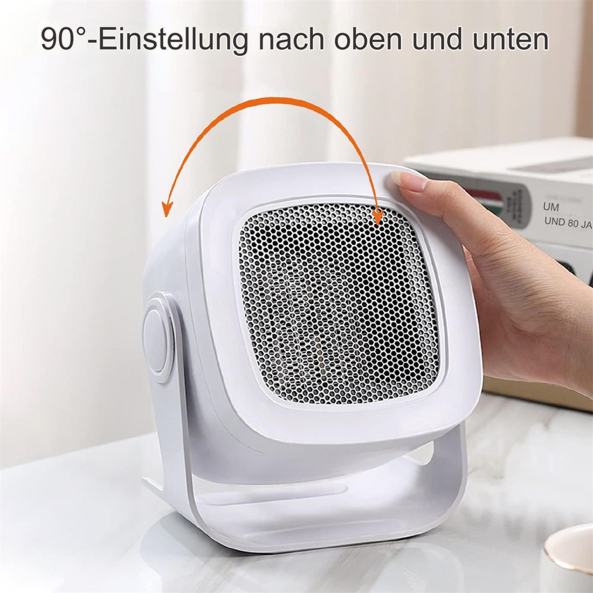 Weißer Heizlüfter mit einstellbarem Winkel, Hand an der Seite.