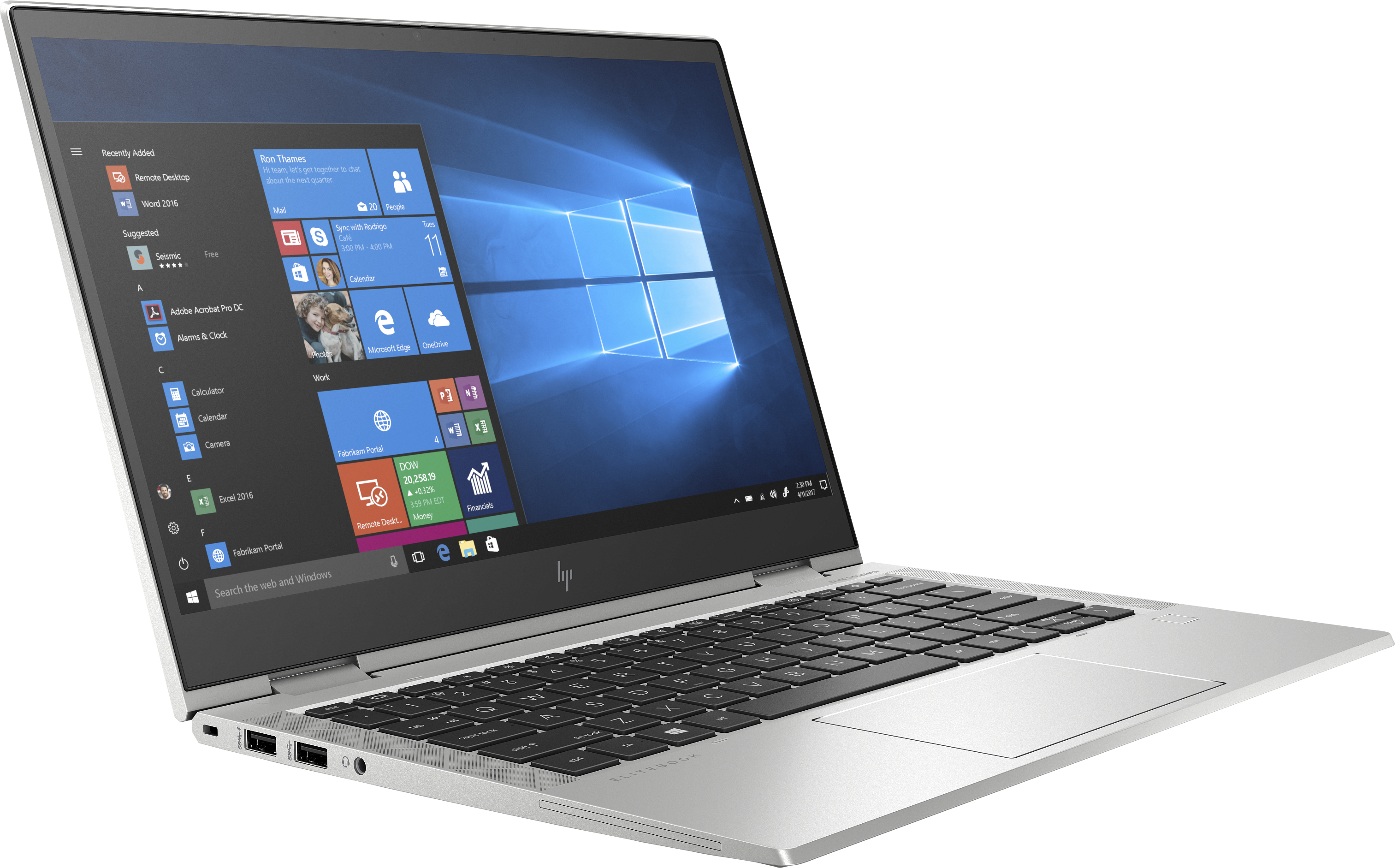 Silver laptop on white surface, screen showing windows, white background.