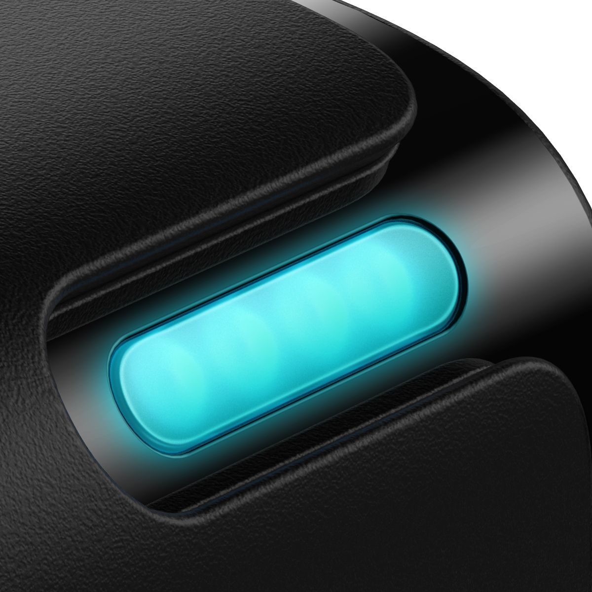 Zbliżenie czarnego urządzenia z świecącym turkusowym paskiem świetlnym. Światło emitowane z zagłębionego obszaru.