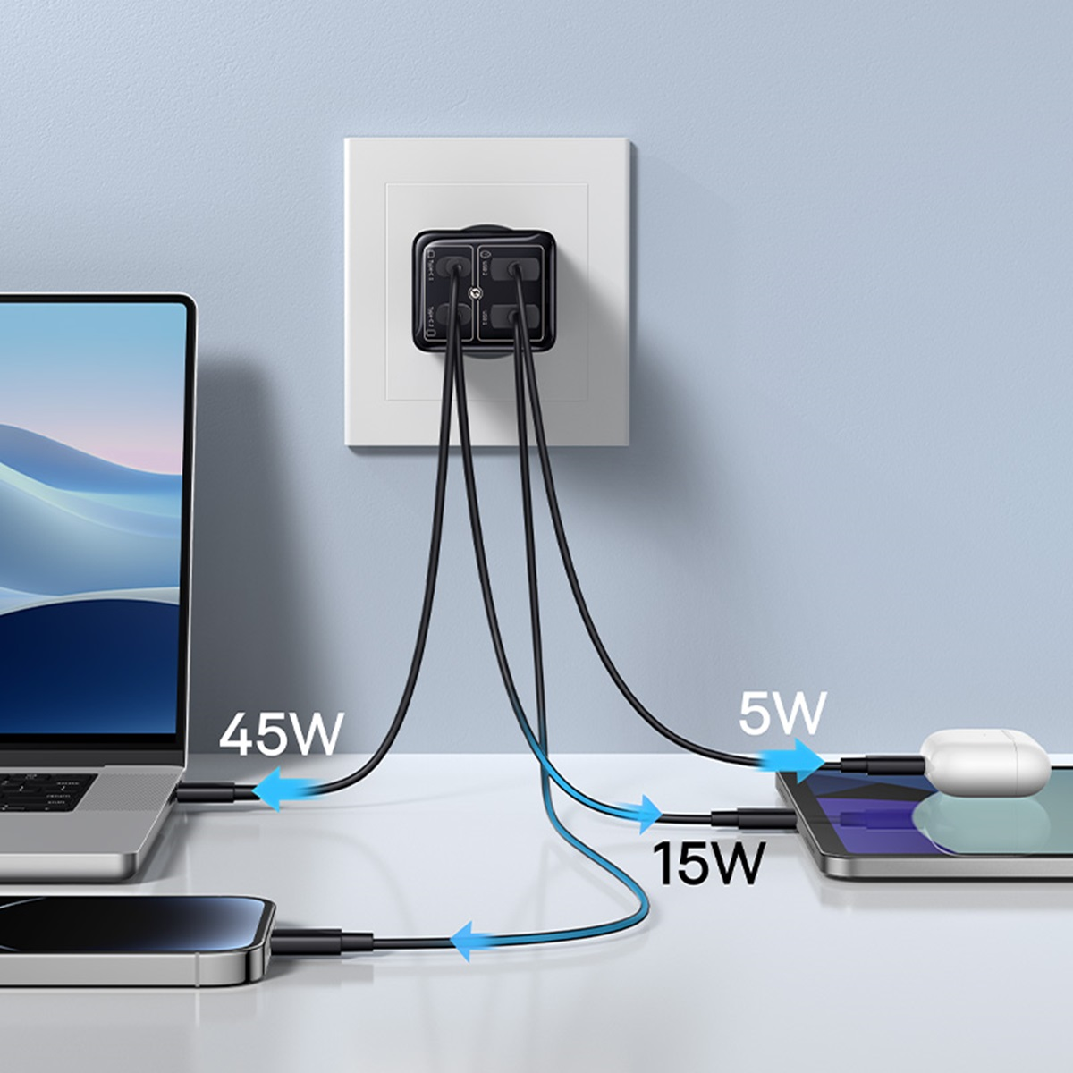 Une prise murale avec plusieurs câbles de charge connectés à un ordinateur portable, un téléphone et une tablette. Flèches affichent.