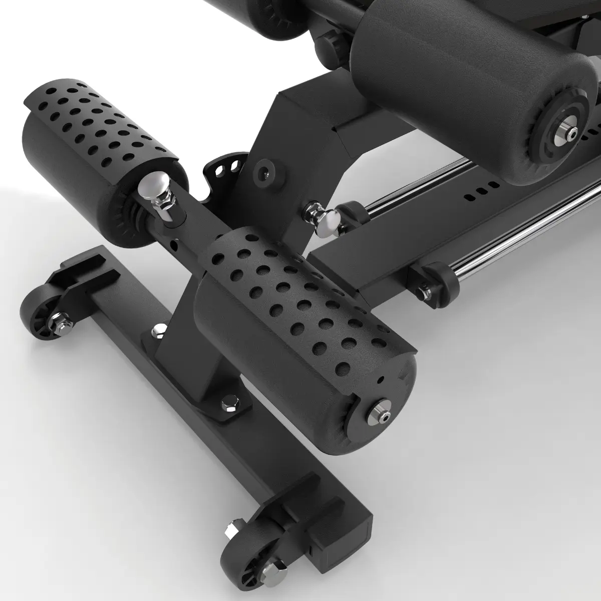 Black and silver weight training machine. It has padded leg supports and wheels.