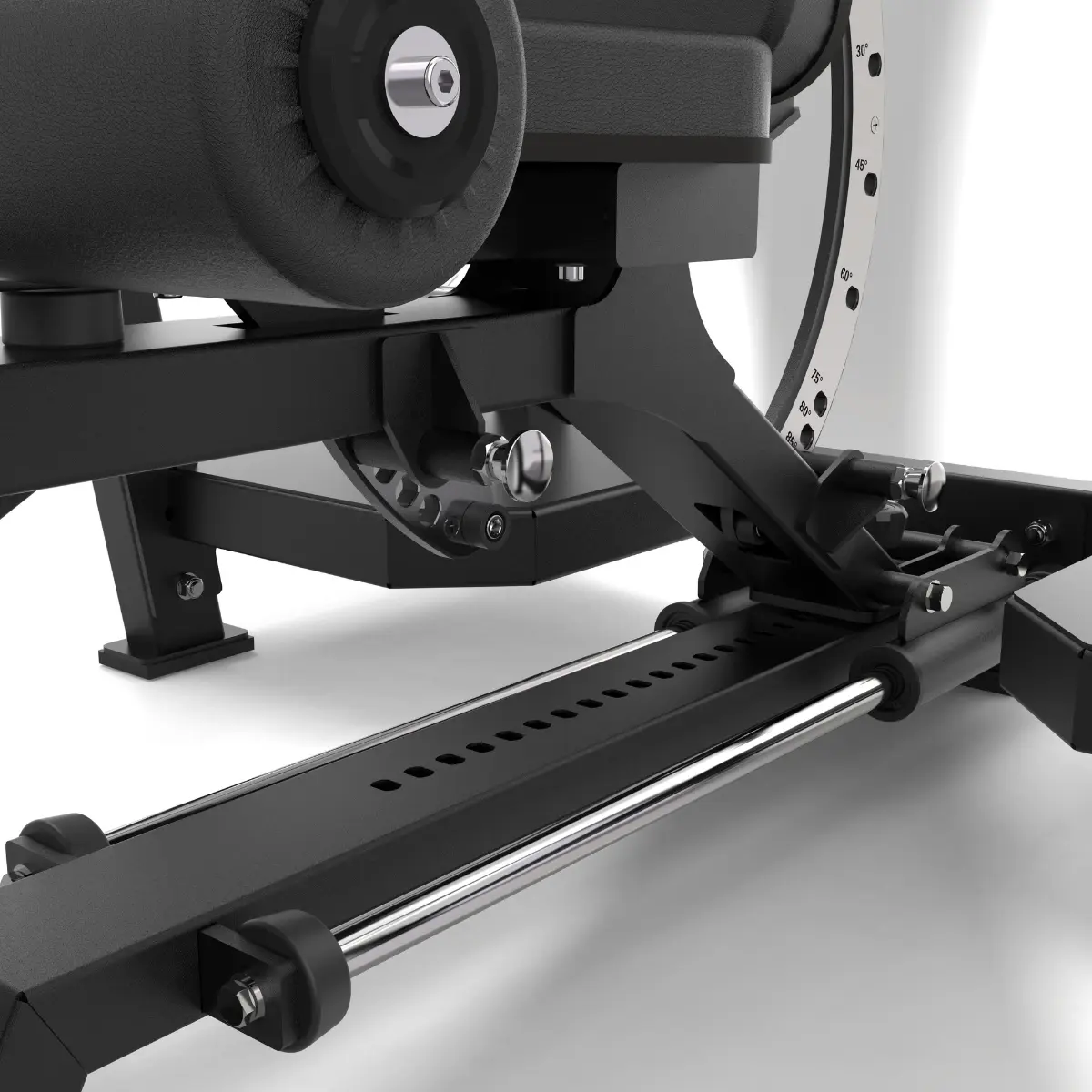 Black gym machine with leg pads and a metal frame. Visible bolts and a circular weight indicator.