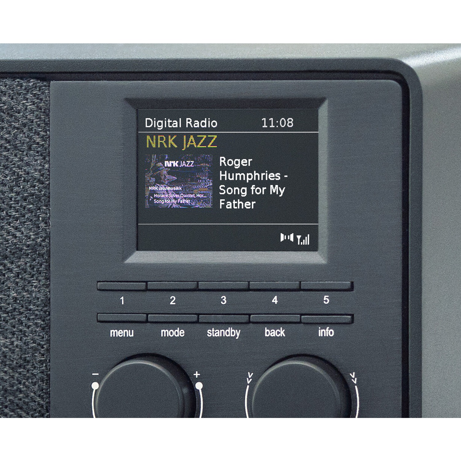 Digital radio with a screen displaying station information. Buttons and dials are visible.