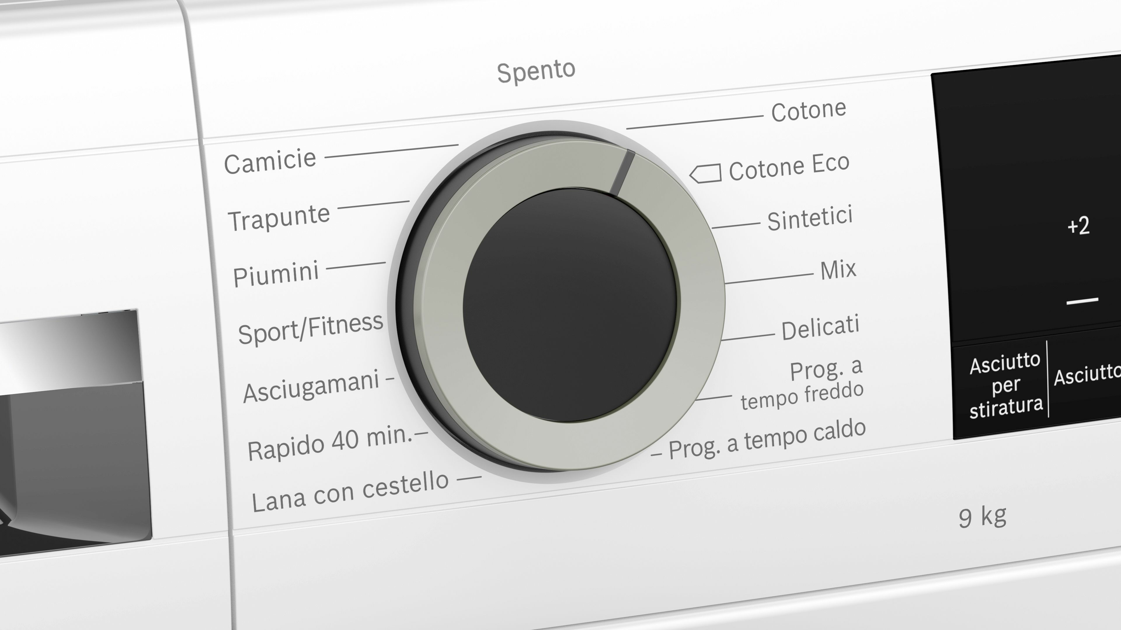 Primo piano della manopola di una lavatrice impostata su 'Cotone Eco', con una linea indicatrice grigia.