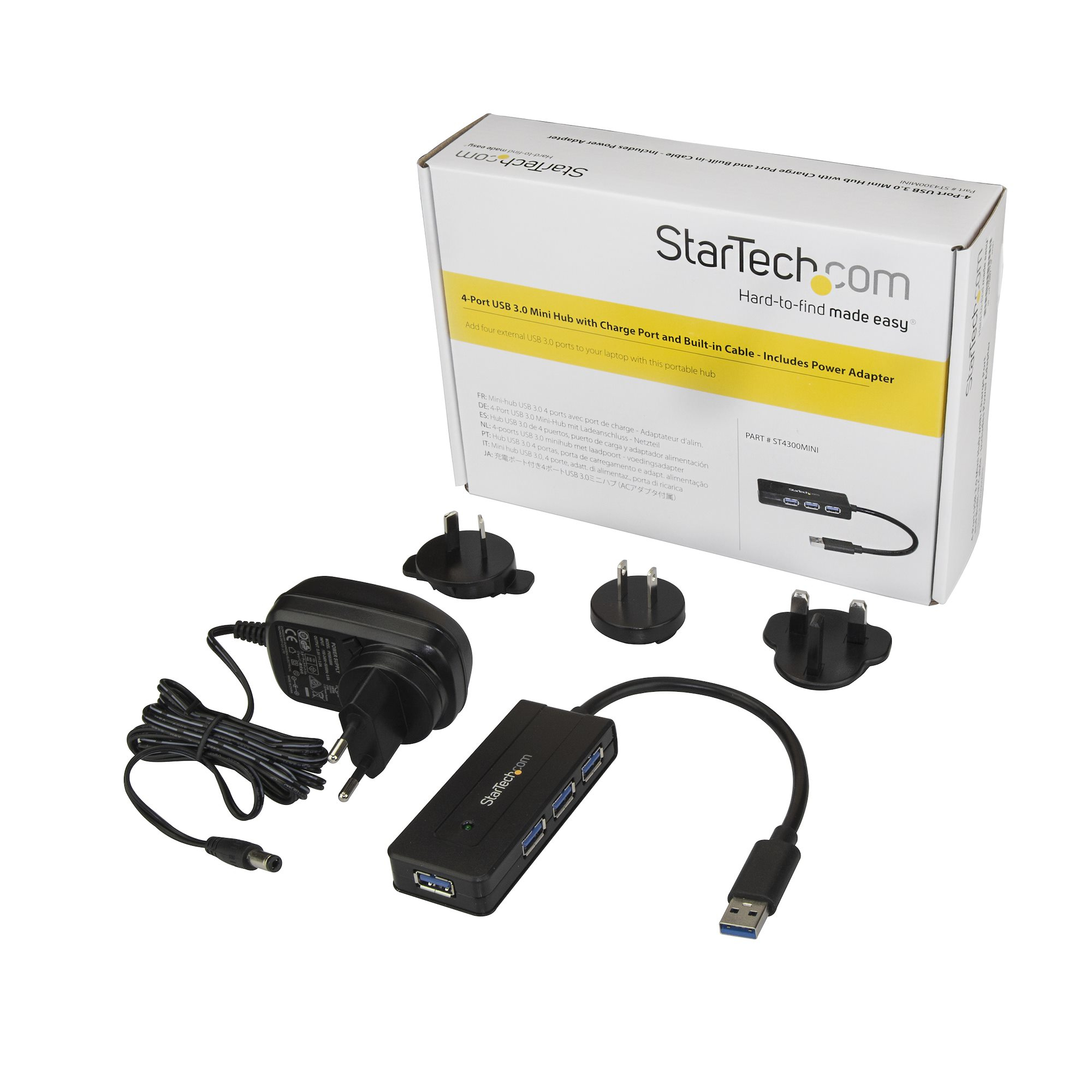 Concentrador USB con adaptador de corriente. Caja, concentrador, adaptador y enchufes.