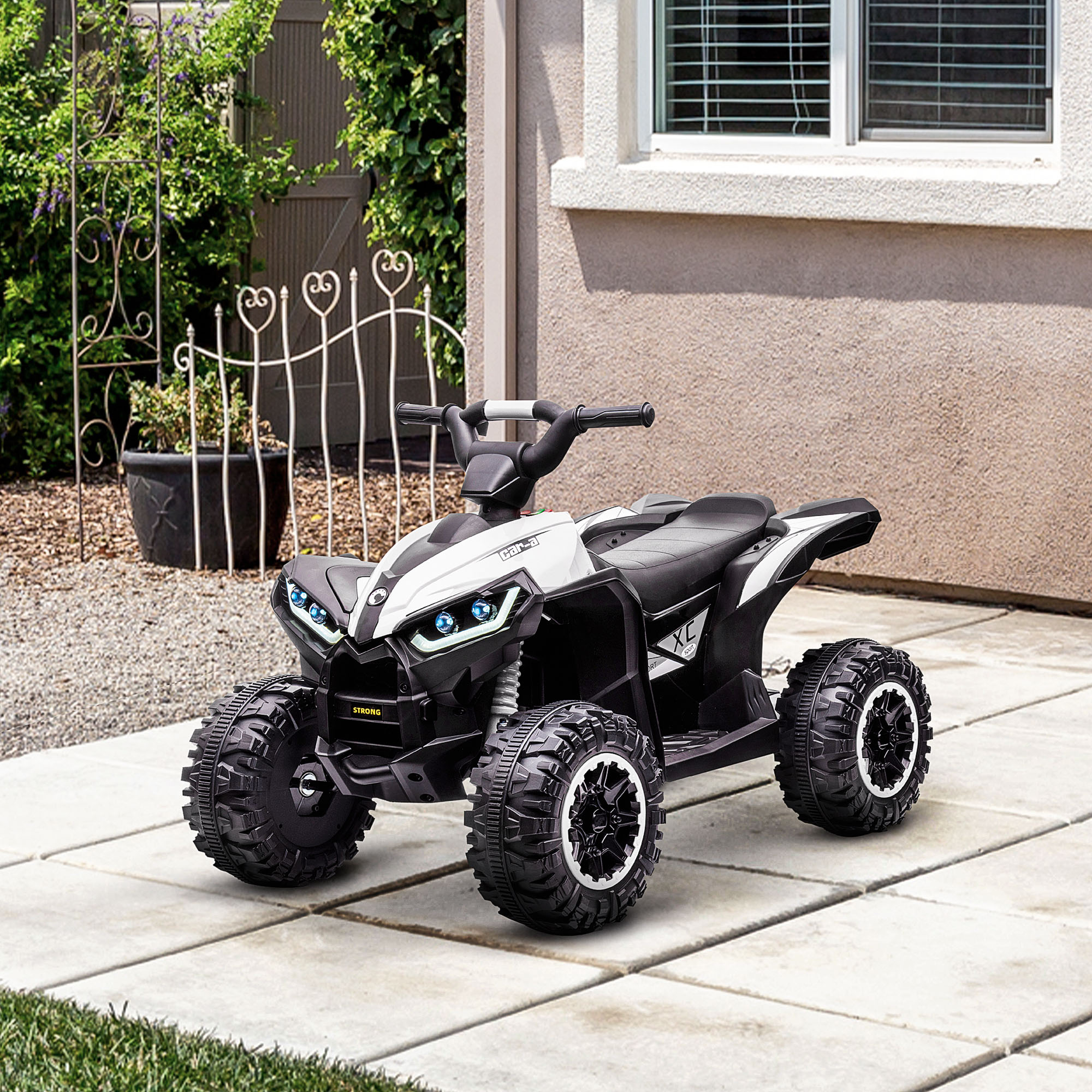 ATV giocattolo verde con dettagli neri, bianchi e una grande ruota.