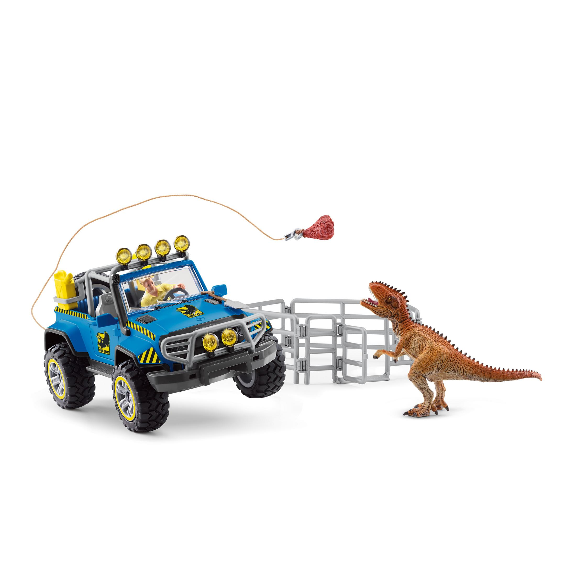 Macchina giocattolo che insegue un dinosauro. Auto blu con luci. Dinosauro in piedi.