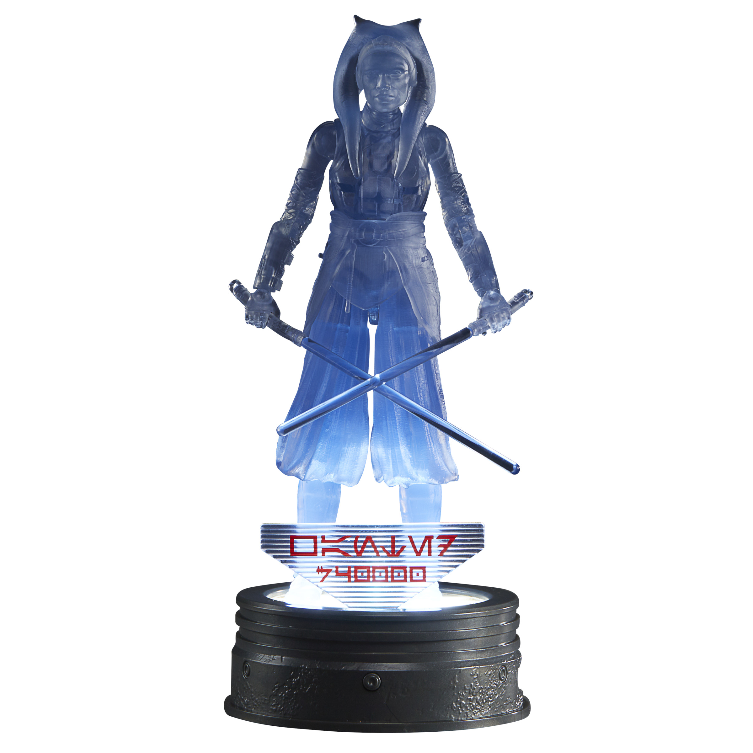 Figura holográfica azul de Ahsoka Tano con sables de luz, sobre una base.