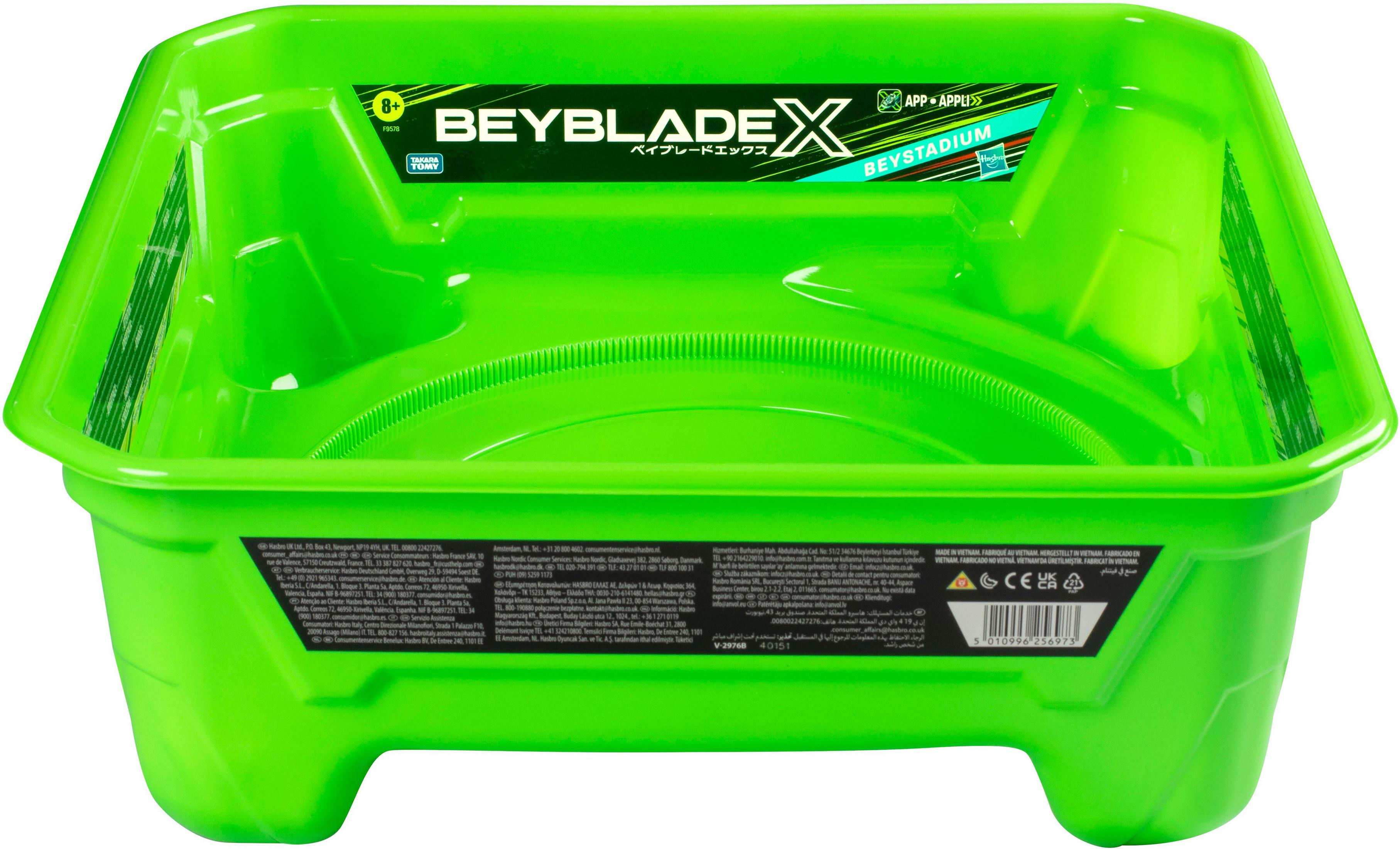 Stadio Beyblade X verde brillante. È un giocattolo quadrato con un centro rotondo.