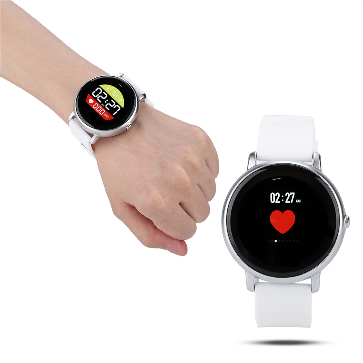 Eine Person, die eine weiße Smartwatch trägt. Daneben liegt eine weitere Smartwatch, die die Herzfrequenz anzeigt.