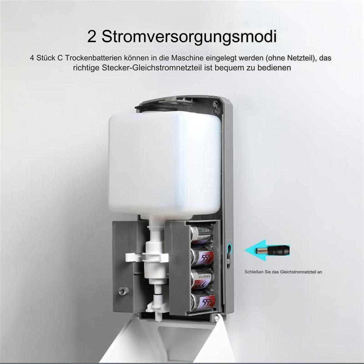 Ein automatischer, wandmontierter Seifenspender mit Batterien und Stromanschluss.
