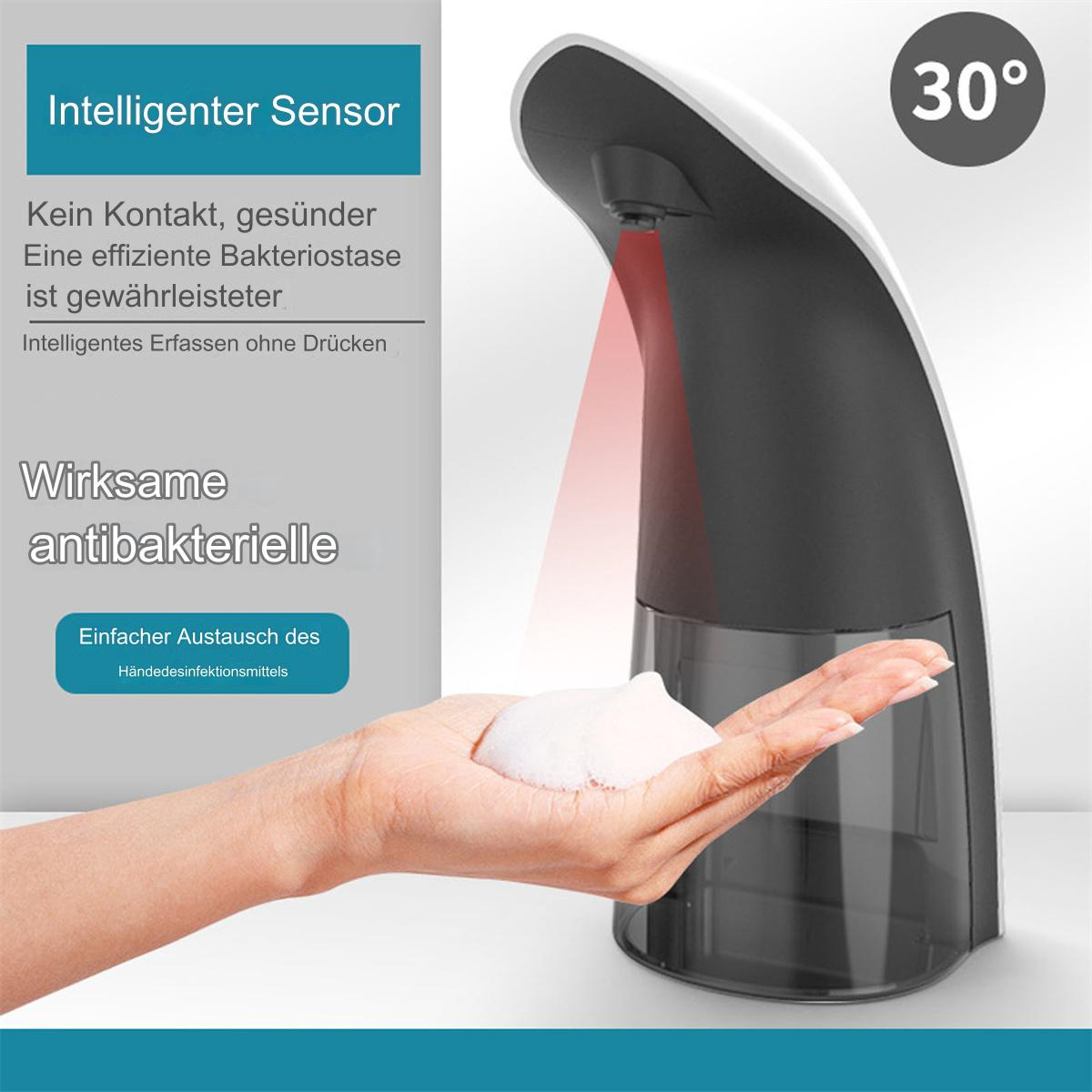 Eine Hand, die Seife aus einem automatischen Spender abgibt. Text auf Deutsch daneben.