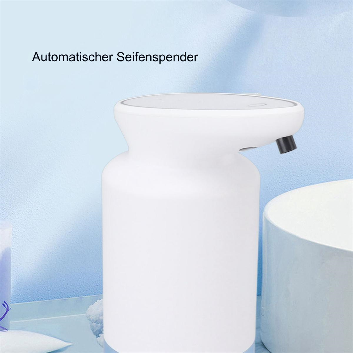 Weißer automatischer Seifenspender mit deutschem Text, vor hellblauem Hintergrund.