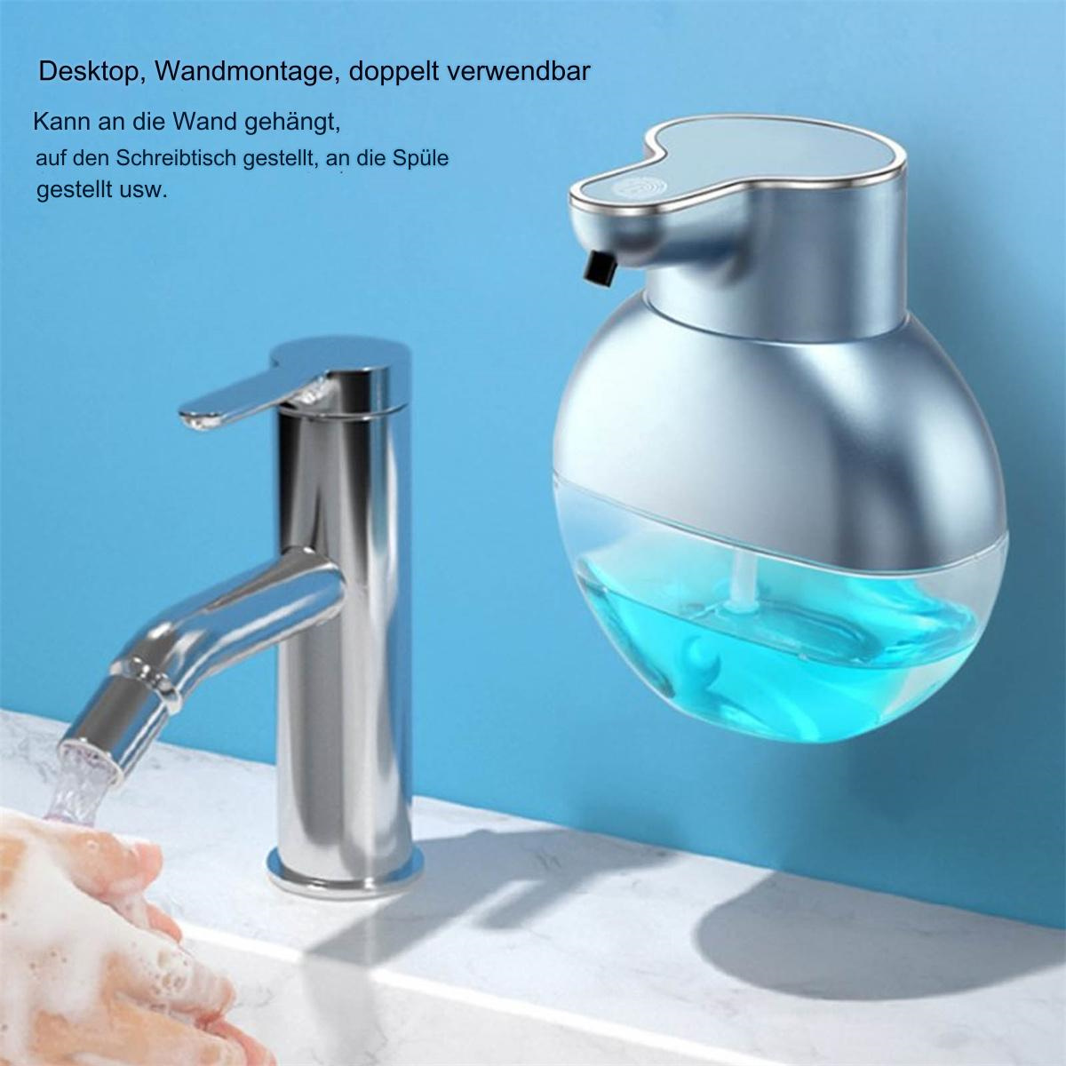 Ein blauer und silberner automatischer Seifenspender mit einem Wasserhahn davor.