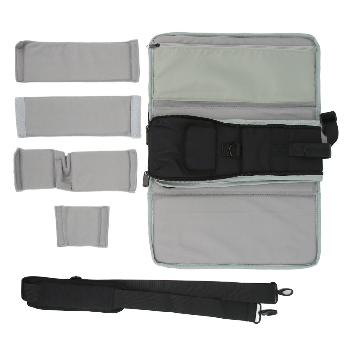 Ein Reise-Organizer mit mehreren grauen Pads und einem schwarzen Reißverschlussfach.