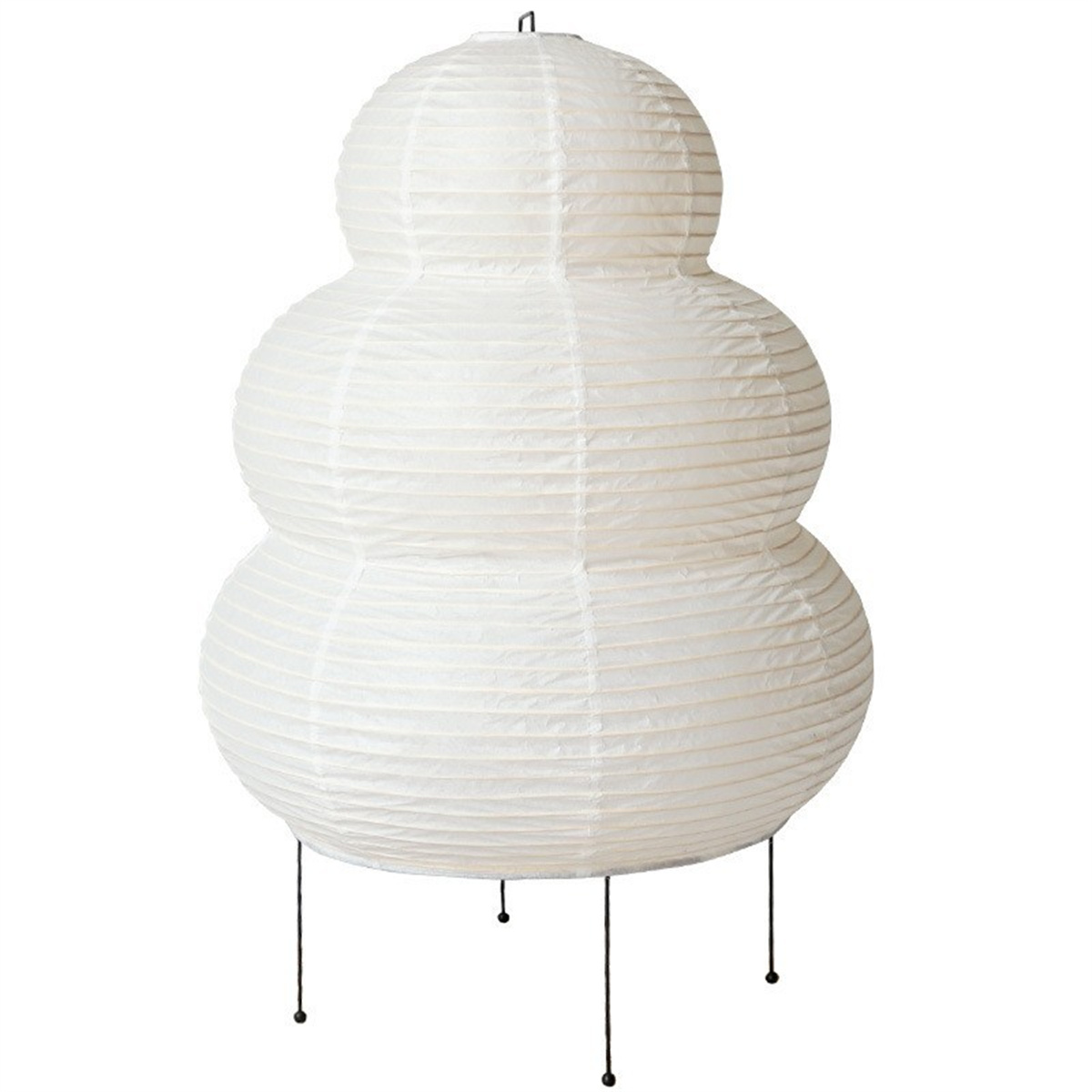 Weiße Papierlaternenlampe in Schneemannform, stehend auf schwarzen Beinen, weißer Hintergrund.