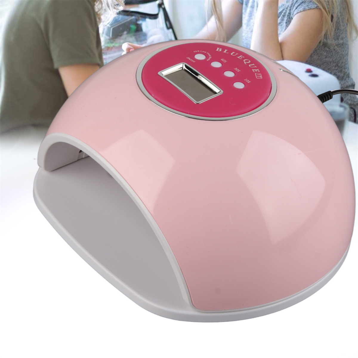 Eine pinkfarbene UV-Nagellampe mit Digitalanzeige und Knöpfen. Es hat ein geschwungenes Design und einen weißen Innenraum.
