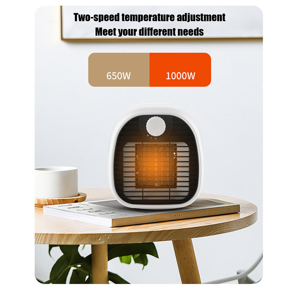 Ein kleiner weißer Heizlüfter auf einem Tisch mit einem Schild mit 650W und 1000W.