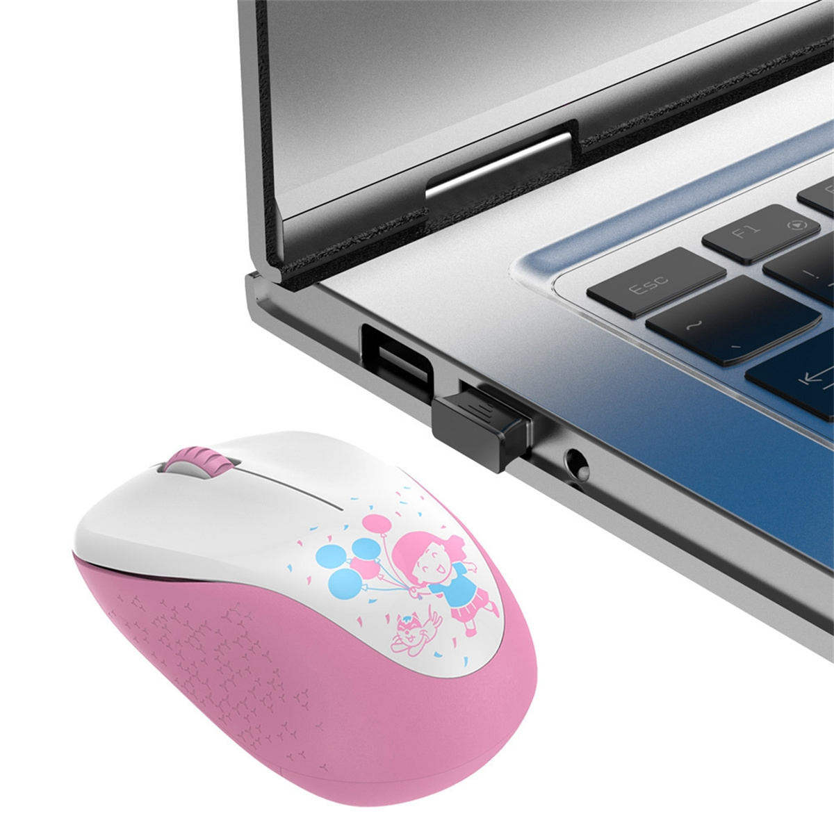 Drahtlose Maus in Pink und Weiß neben einem Laptop, mit Cartoon-Design.