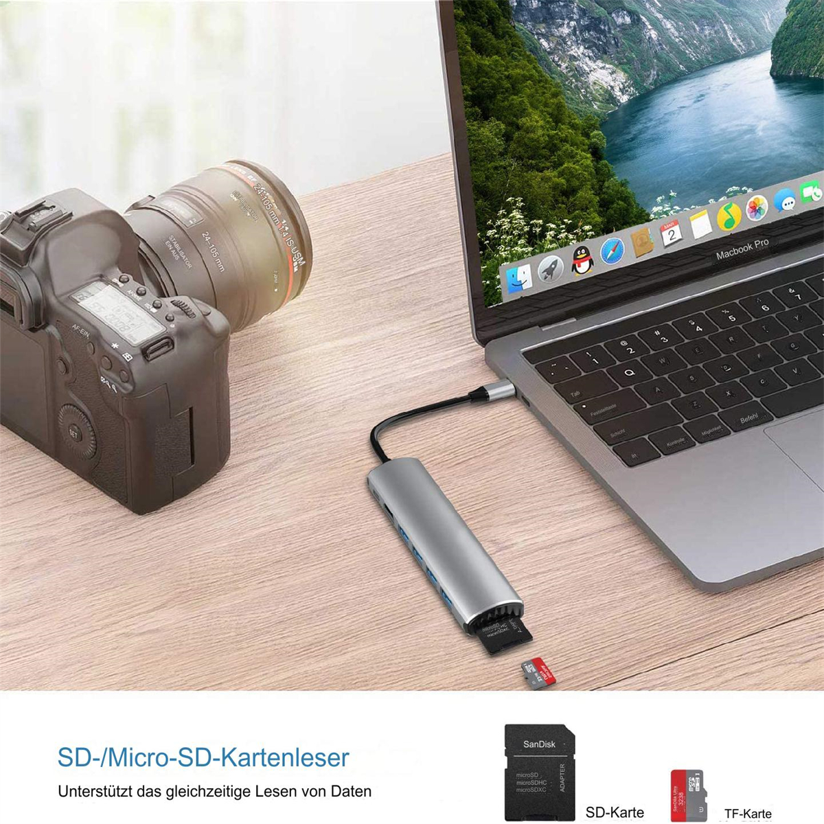 Laptop mit angeschlossenem Hub und SD-Karten auf dem Tisch.