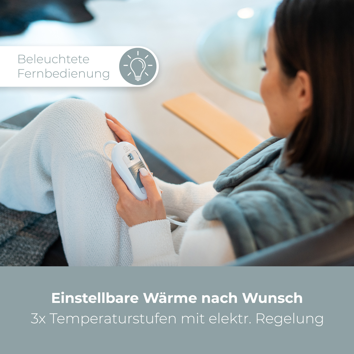 Kobieta trzyma biały pilot. Tekst wskazuje regulowane poziomy ciepła i temperatury.