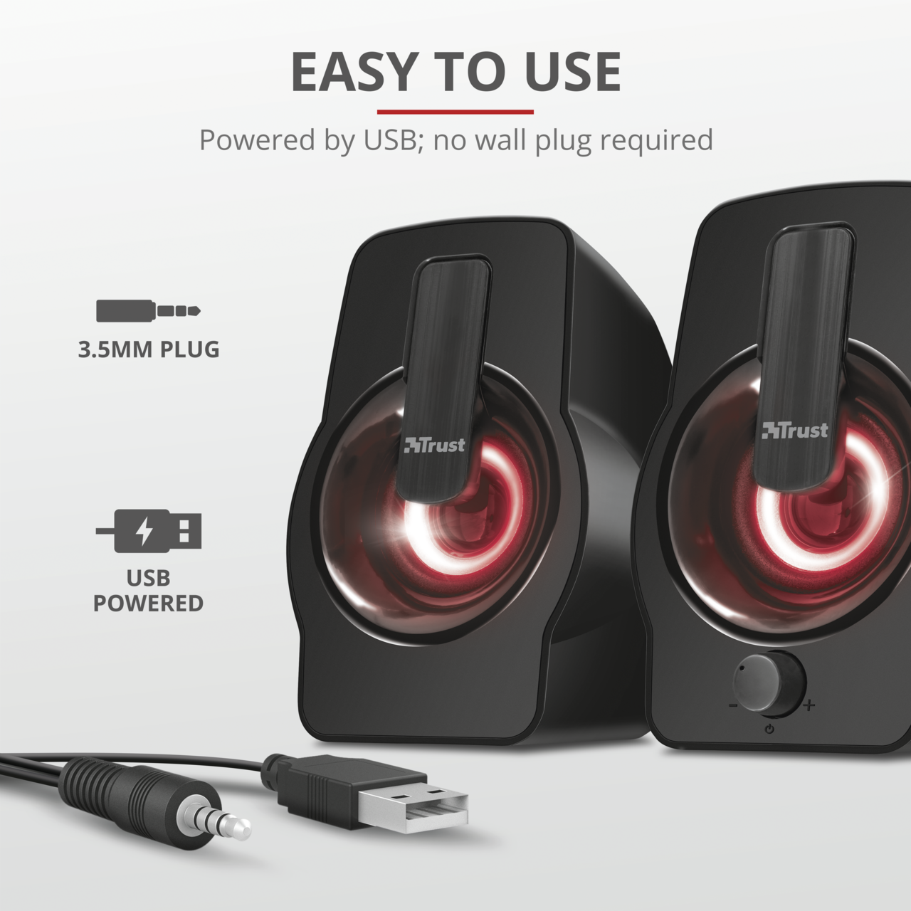 Black computer speakers with red internal lighting, USB powered, and a 3.5mm plug.