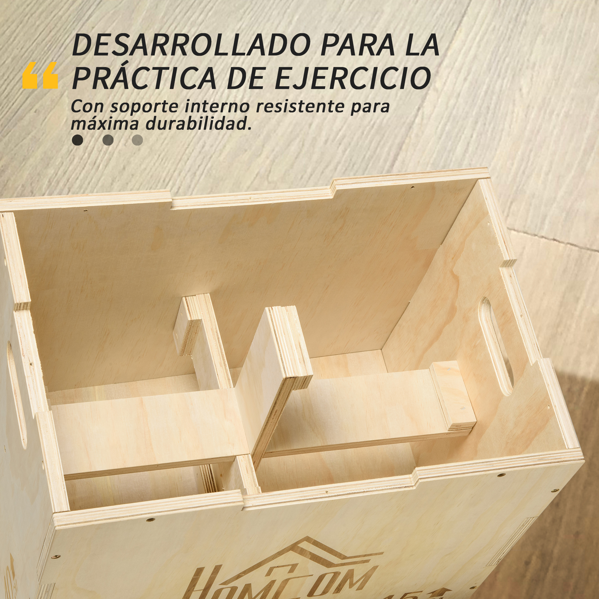 Una caja de ejercicios de madera abierta, con soportes internos y texto superpuesto en español.