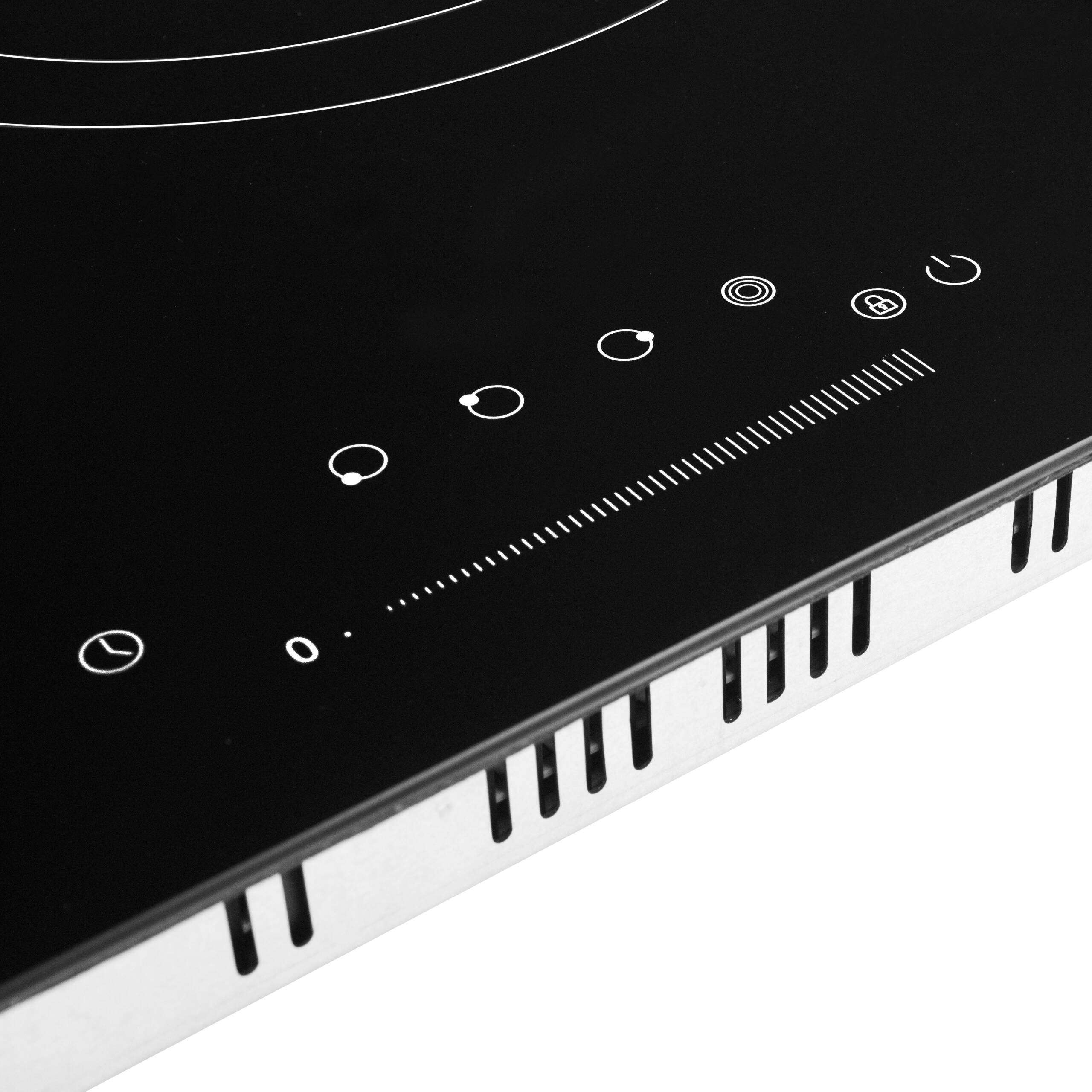 Primer plano del panel de control de una placa de inducción con controles táctiles.