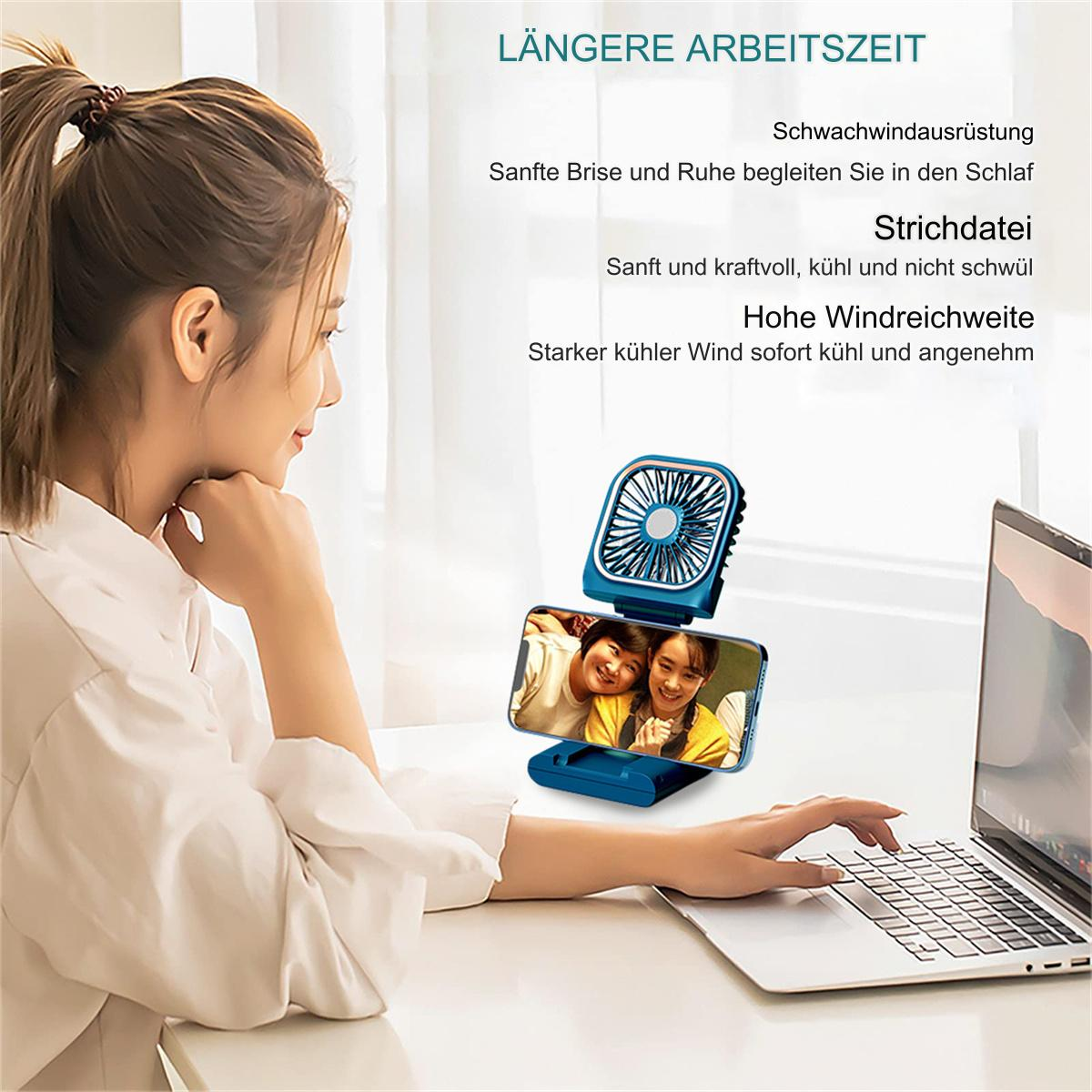 Frau, die einen Laptop benutzt, mit einem kleinen Ventilator am Telefonhalter.