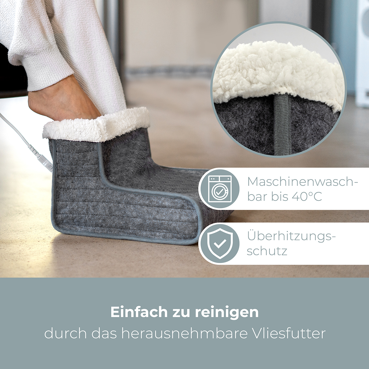 Stopa w szarym podgrzewanym bucie. Tekst o praniu i ochronie przed przegrzaniem. Tło białe.