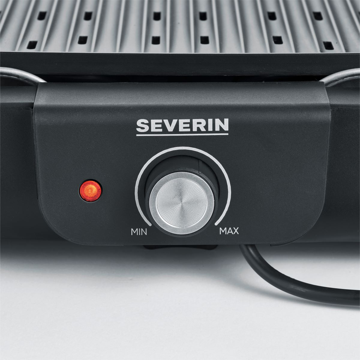 Black Severin grill control panel with dial and light.