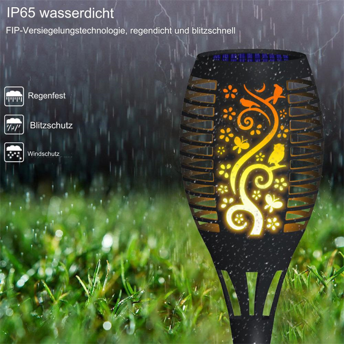 Solarbetriebene Fackel mit Flammendesign, in einer grasbewachsenen Umgebung, mit Regen.