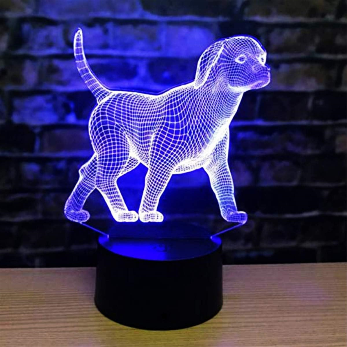 Eine hundeförmige LED-Lampe mit blauem Leuchten, auf schwarzem Sockel.