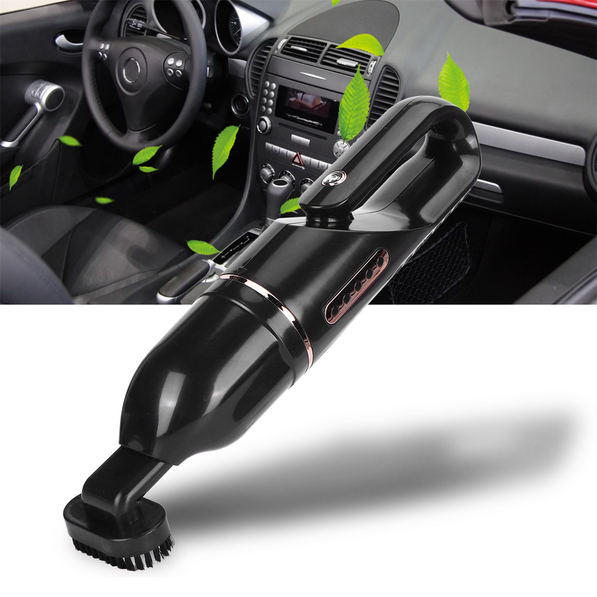 Schwarzer Auto-Staubsauger mit Bürstenaufsatz, mit grünen Blättern im Auto.