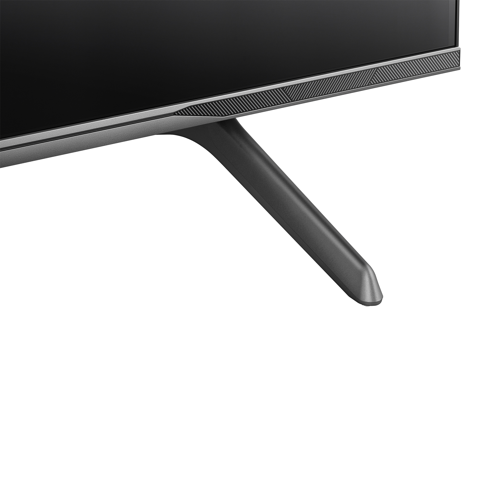 De onderste hoek van een televisie is zichtbaar. Het heeft een zwart scherm, een grijs frame en een zwarte standaard.