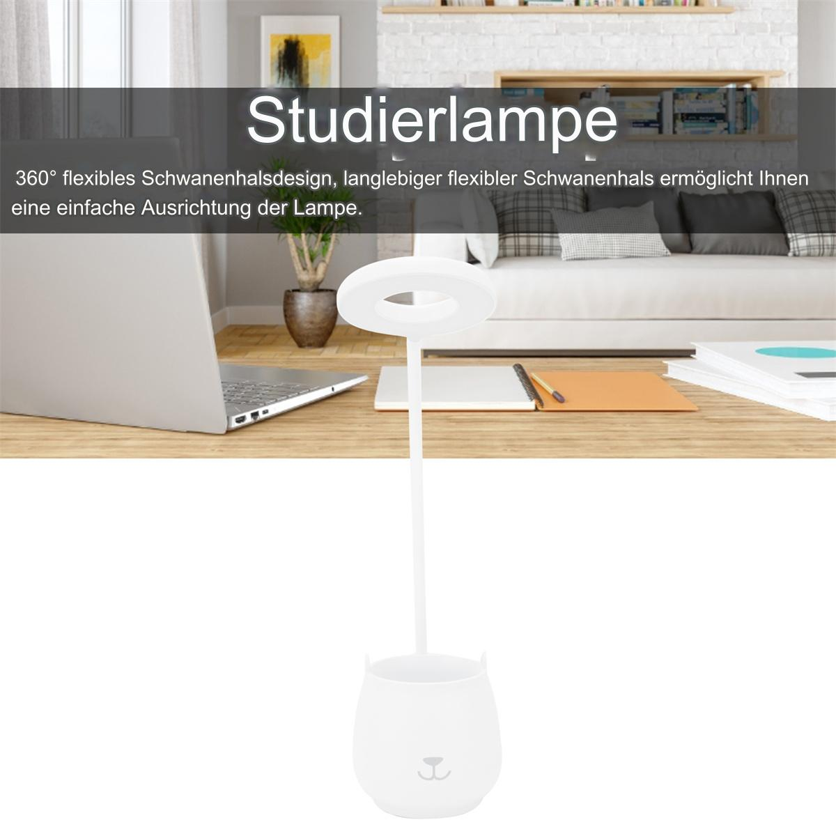 Eine weiße Schreibtischlampe mit ringförmigem Licht, Stifthalter und Laptop. Ein Holztisch.
