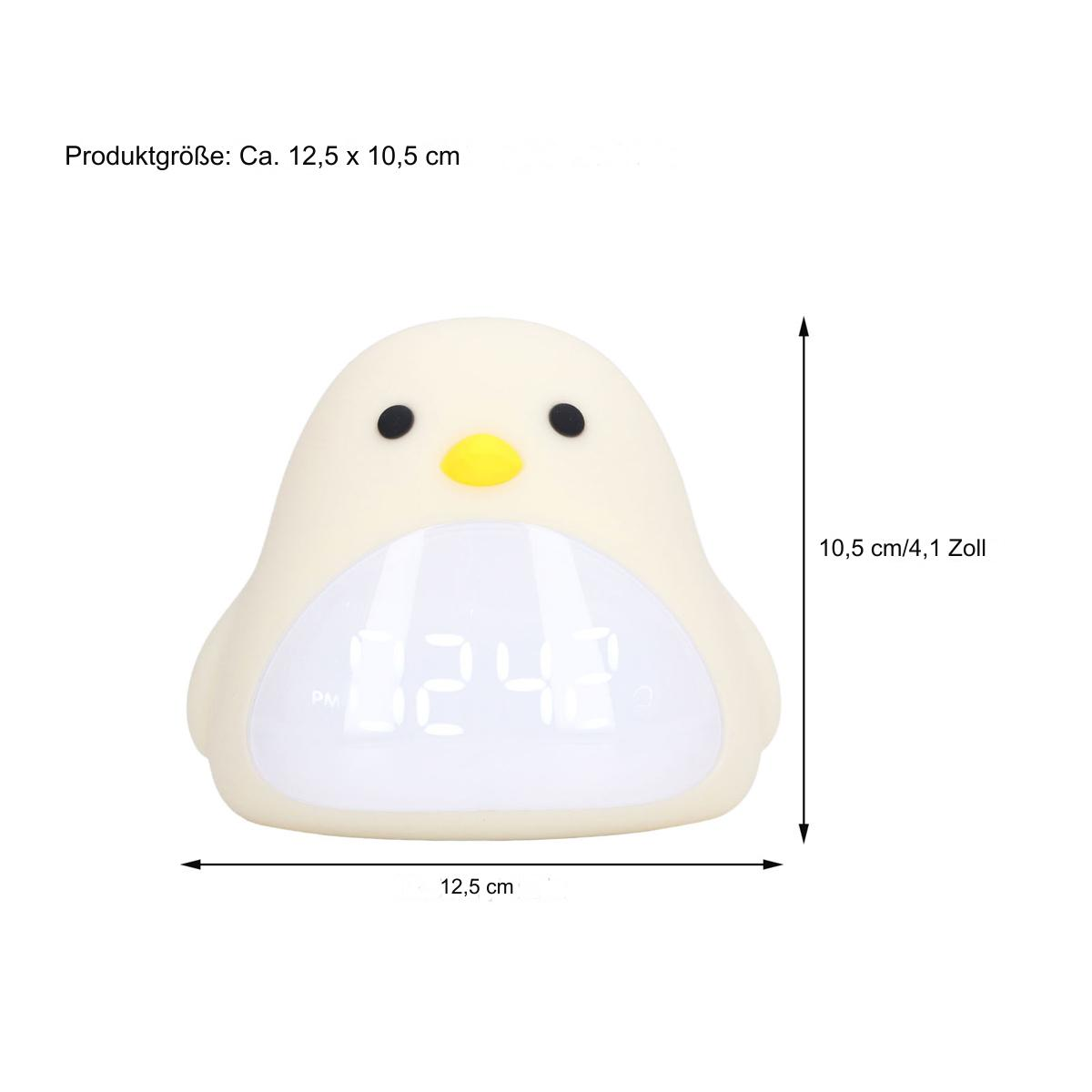 Ein pinguinförmiger Wecker. Er ist weiß mit digitaler Zeitanzeige.