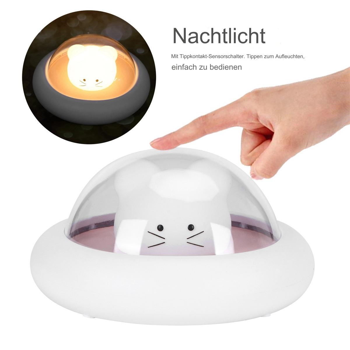 Ein weißes Nachtlicht mit einem katzenförmigen Licht in einer Kuppel, in der Nähe eines darauf zeigenden Fingers.