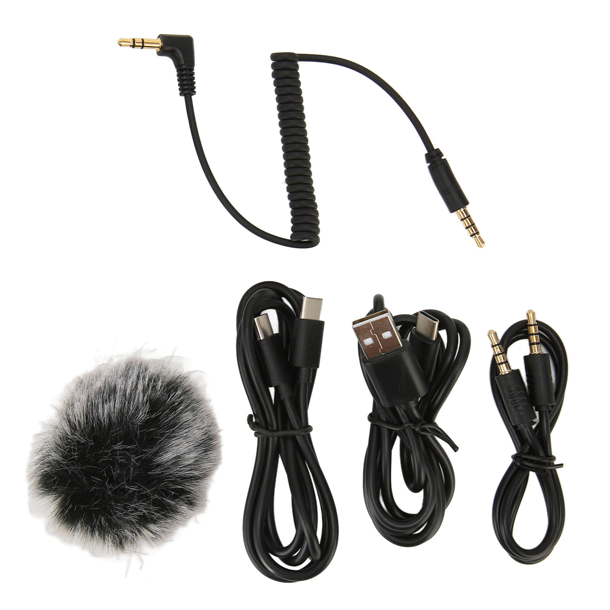 Verschiedene Kabel und Mikrofonzubehör: Audio-, USB- und Mikrofon mit Fellbezug.