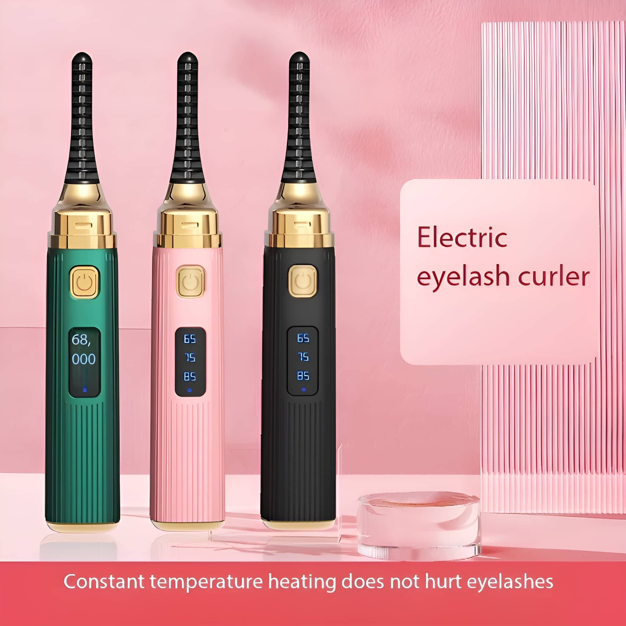 Drei elektrische Wimpernzangen in Grün, Rosa und Schwarz. Rosa Hintergrund mit kleinem Glas.