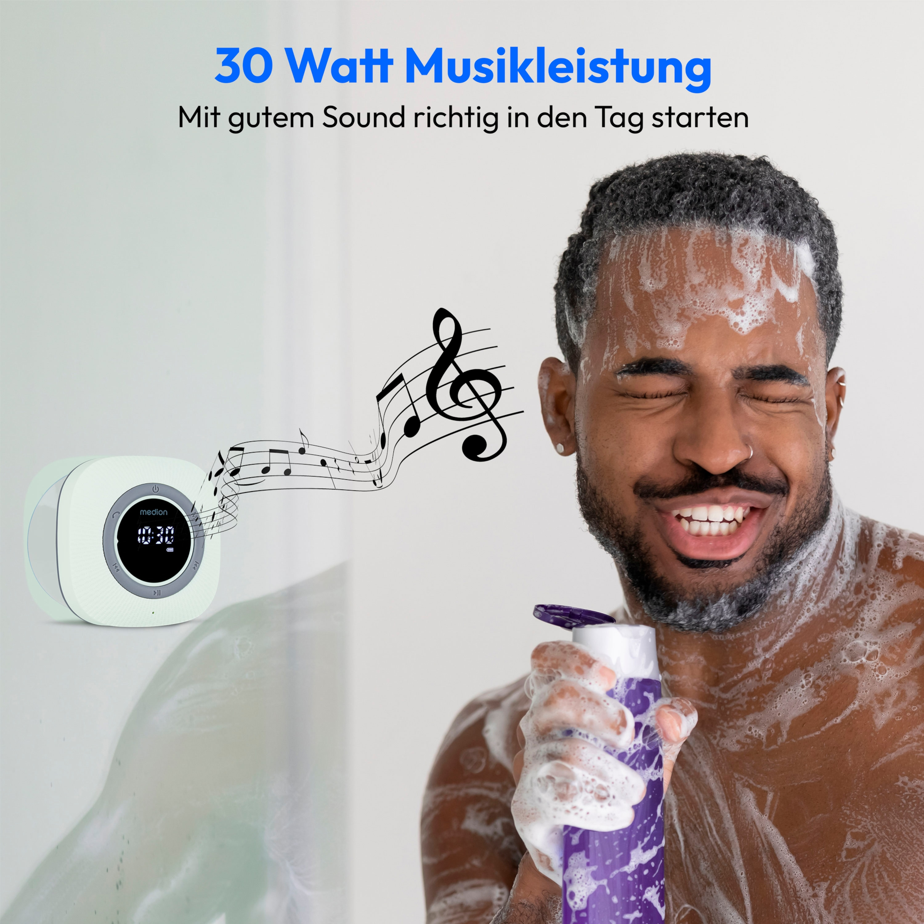 A man washing in the shower with a speaker and music notes on the wall.