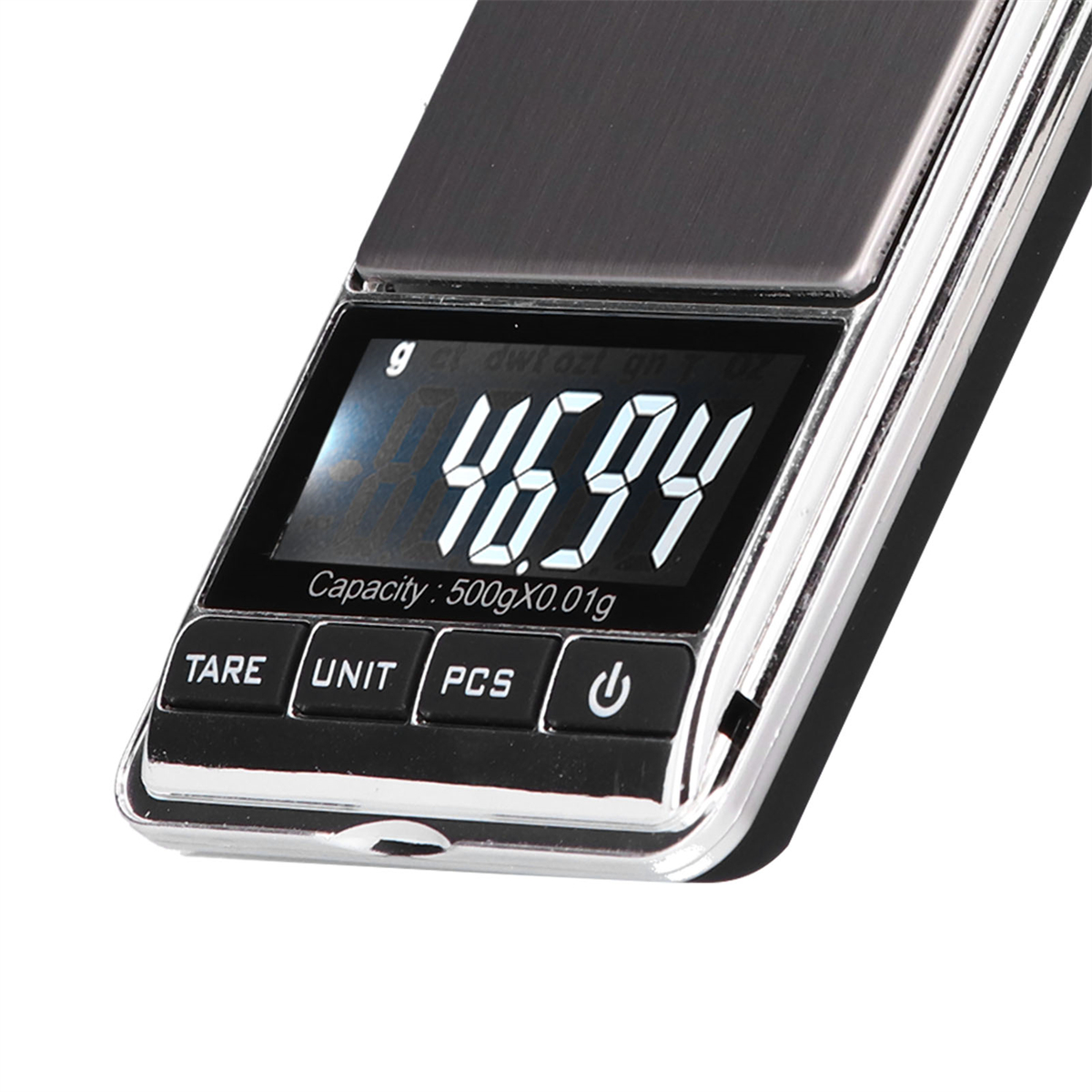 Digitale Taschenwaage zeigt 46,94 an, Kapazität 500g.
