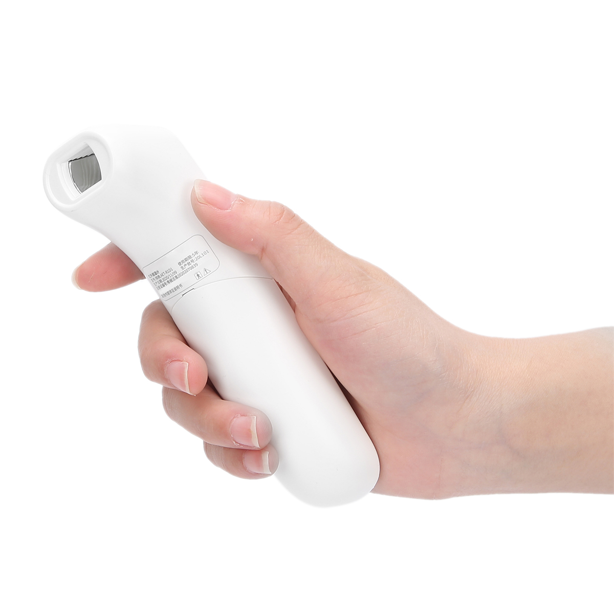 Weißes digitales Thermometer in einer Hand.