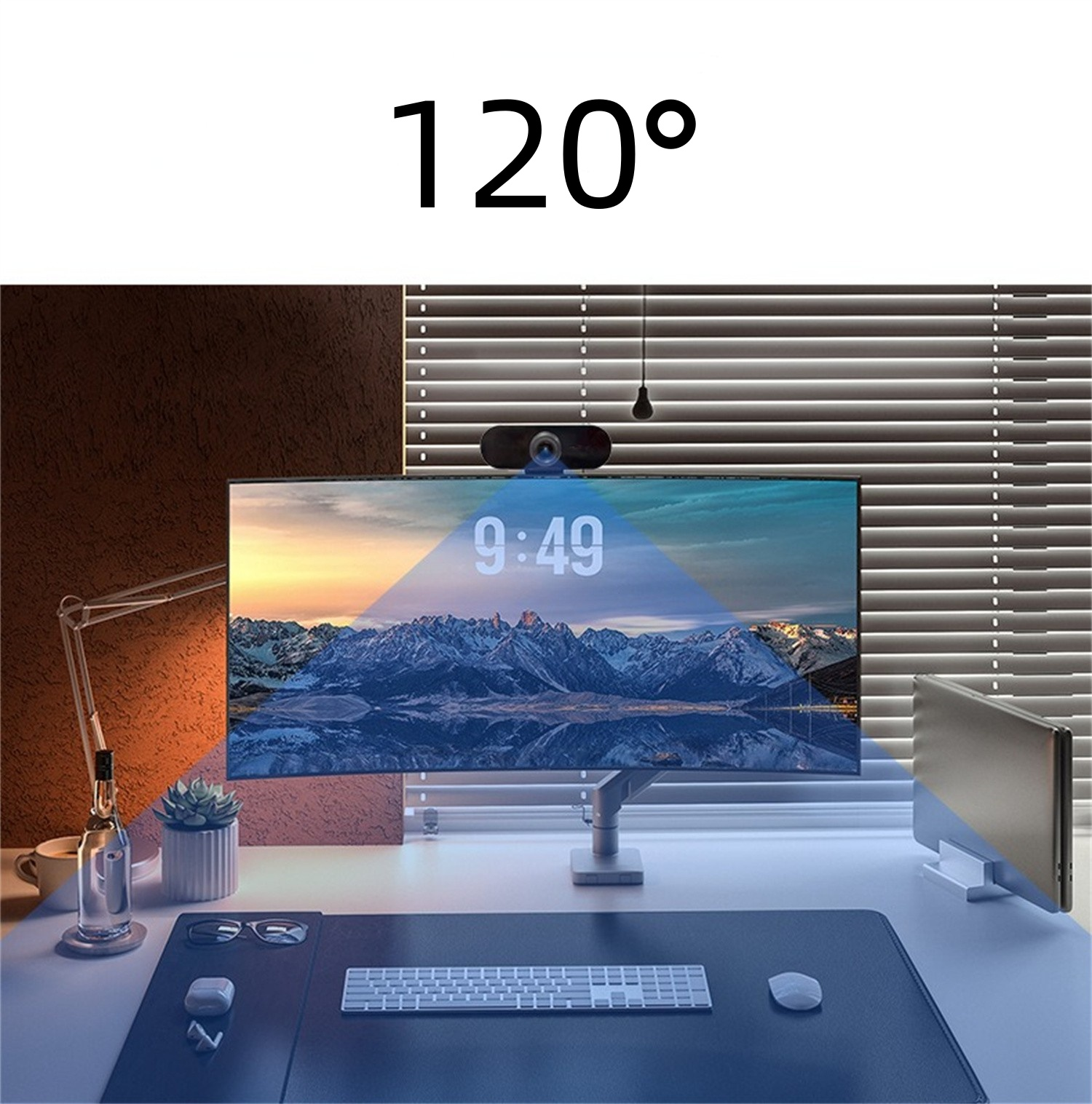 Schreibtischszene mit Monitor, Webcam und Tastatur. Die Zeit ist 9:49 Uhr.
