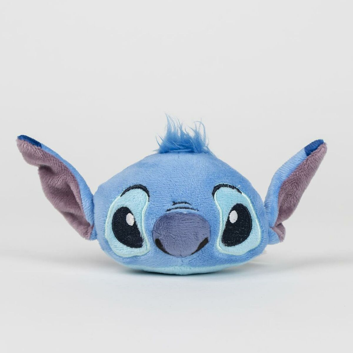Ein kuscheliges blaues Stitch aus Lilo & Stitch. Es hat große schwarze Augen, eine graue Nase und große Ohren.