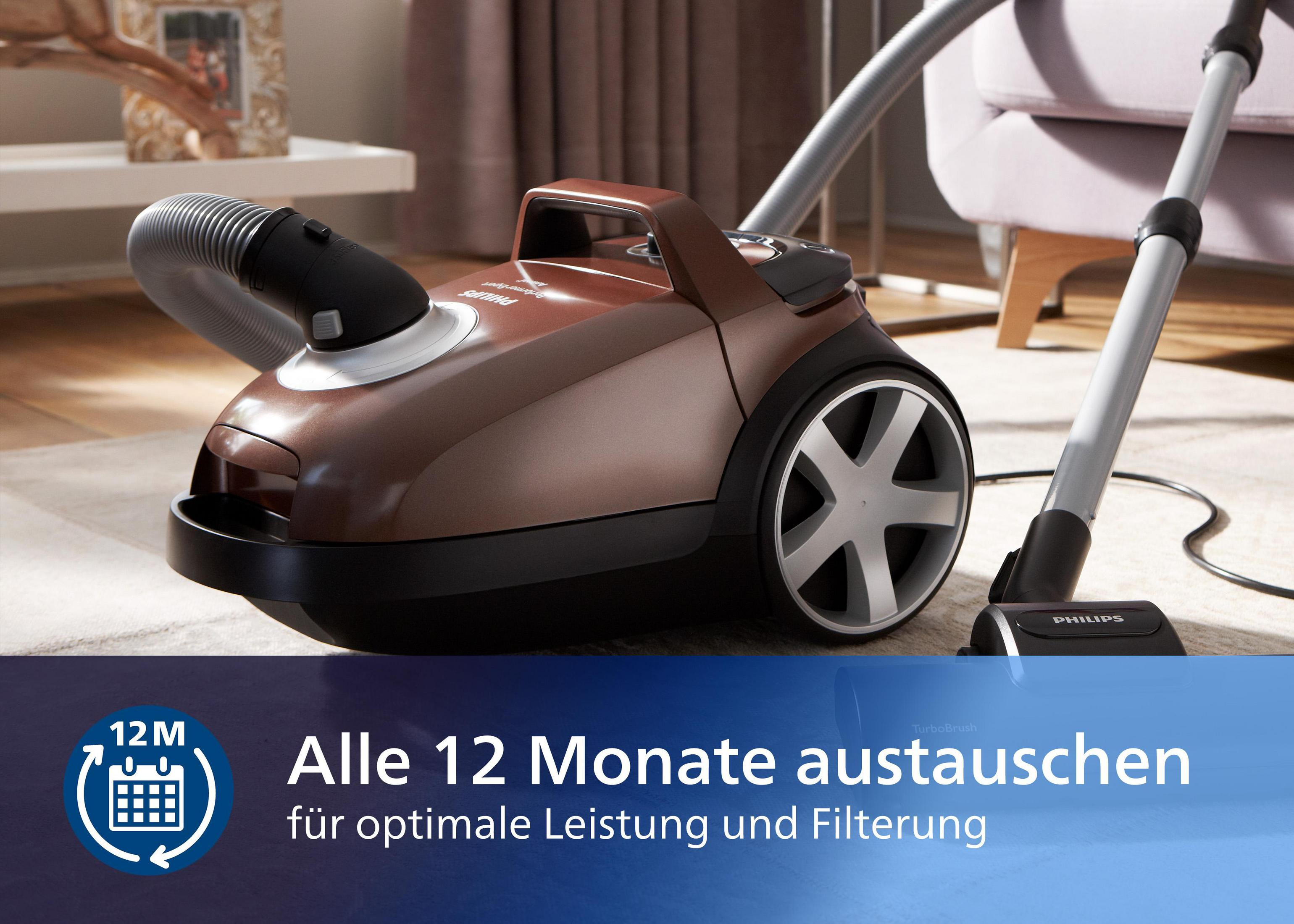 Brauner Staubsauger auf Teppich mit blauem Banner für den Austauschzeitpunkt.