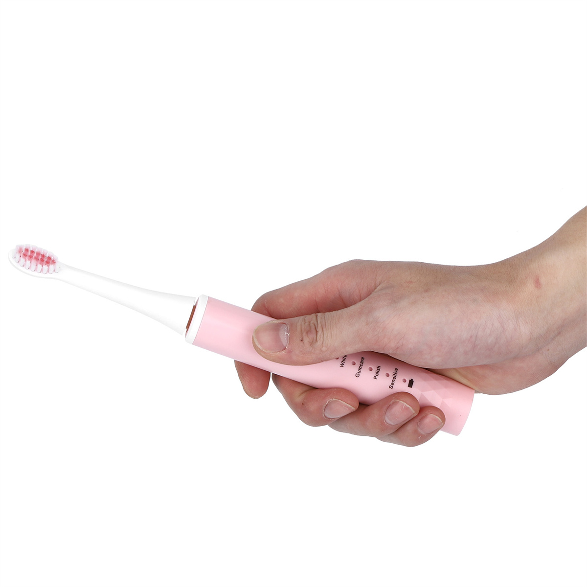 Hand hält eine rosa elektrische Zahnbürste. Der Bürstenkopf ist weiß mit roten Borsten.