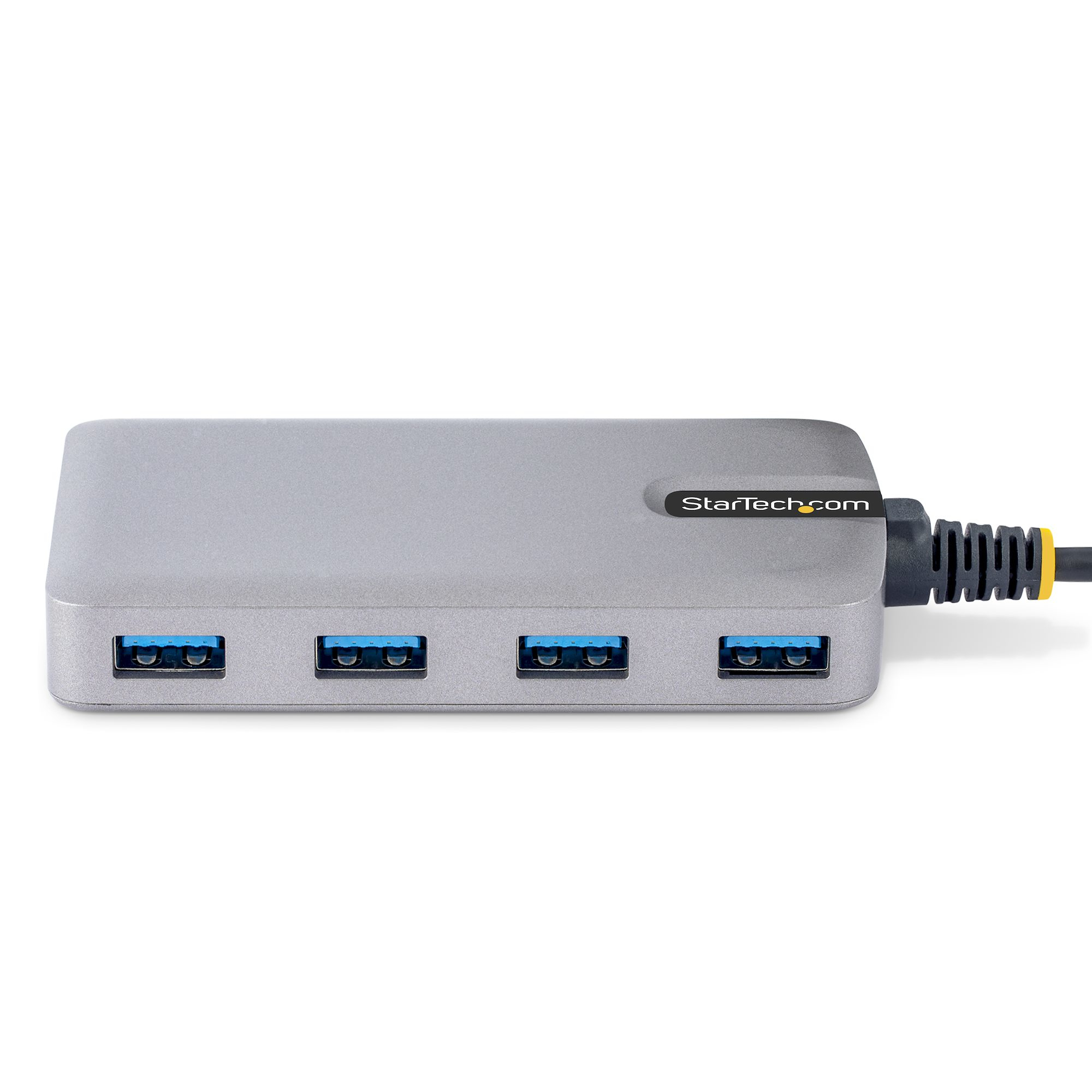Ein silberner USB-Hub mit vier USB-Anschlüssen. Er hat das Logo StarTech.com auf der Oberseite.