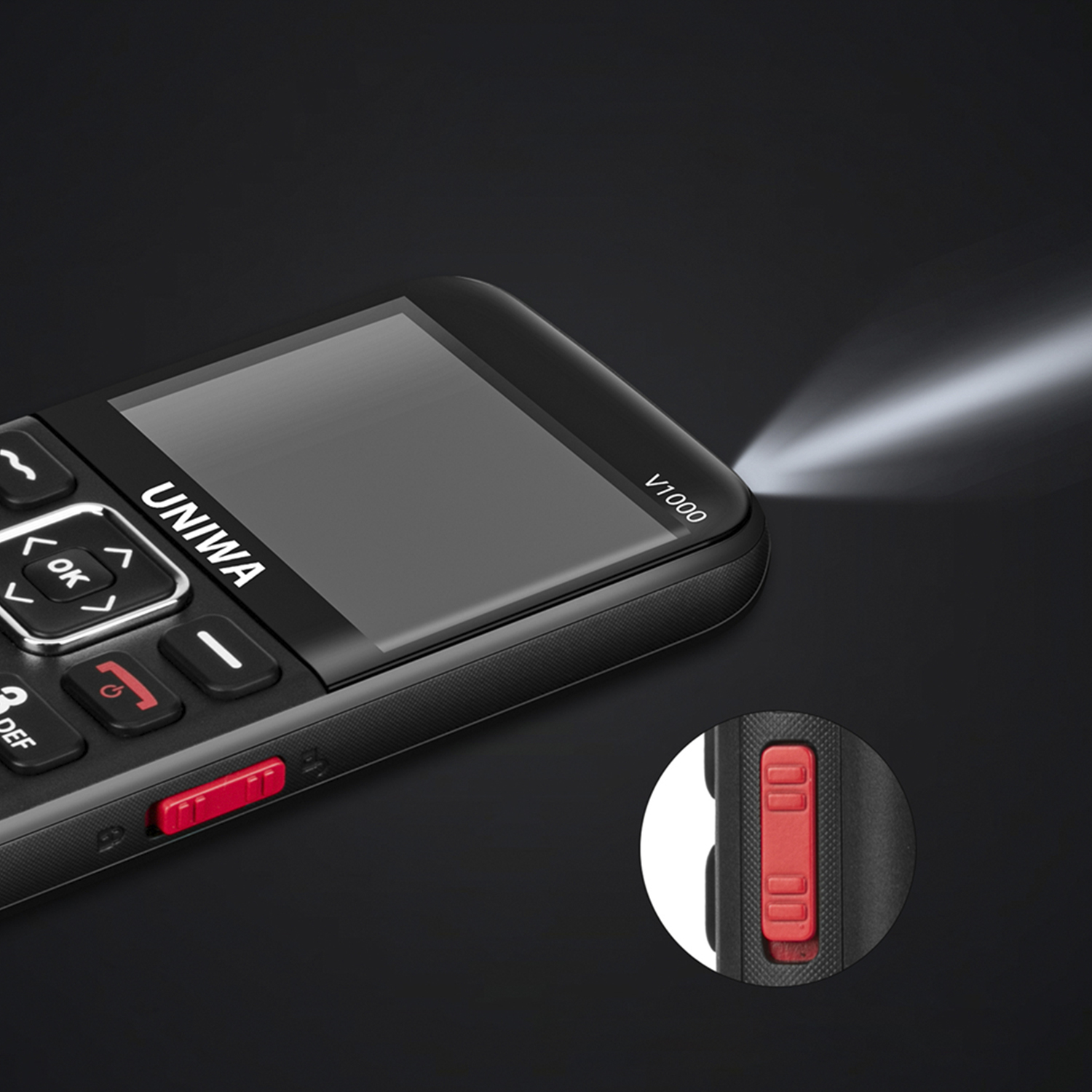 Un teléfono UNIWA V1000 negro, con botones rojos. Una luz brilla desde un lado.
