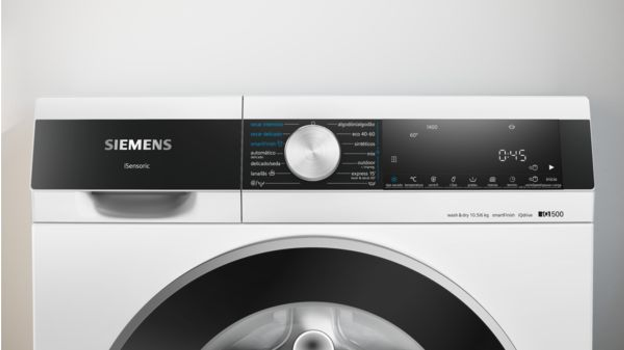 Biały panel sterowania pralki z pokrętłem, wyświetlaczem i przyciskami do ustawień.